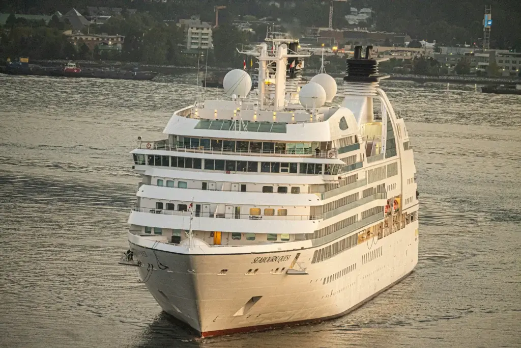 Photo-of-Seabourn-Quest-ocean-cruise-ship-bow-facing-forward-on-water-at-sunset