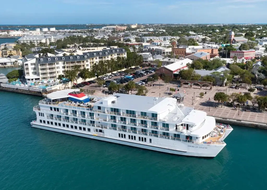 Photo-of-aerial-view-of-American-Legend-coastal-cruise-ship-docked-at-sunny-city-port