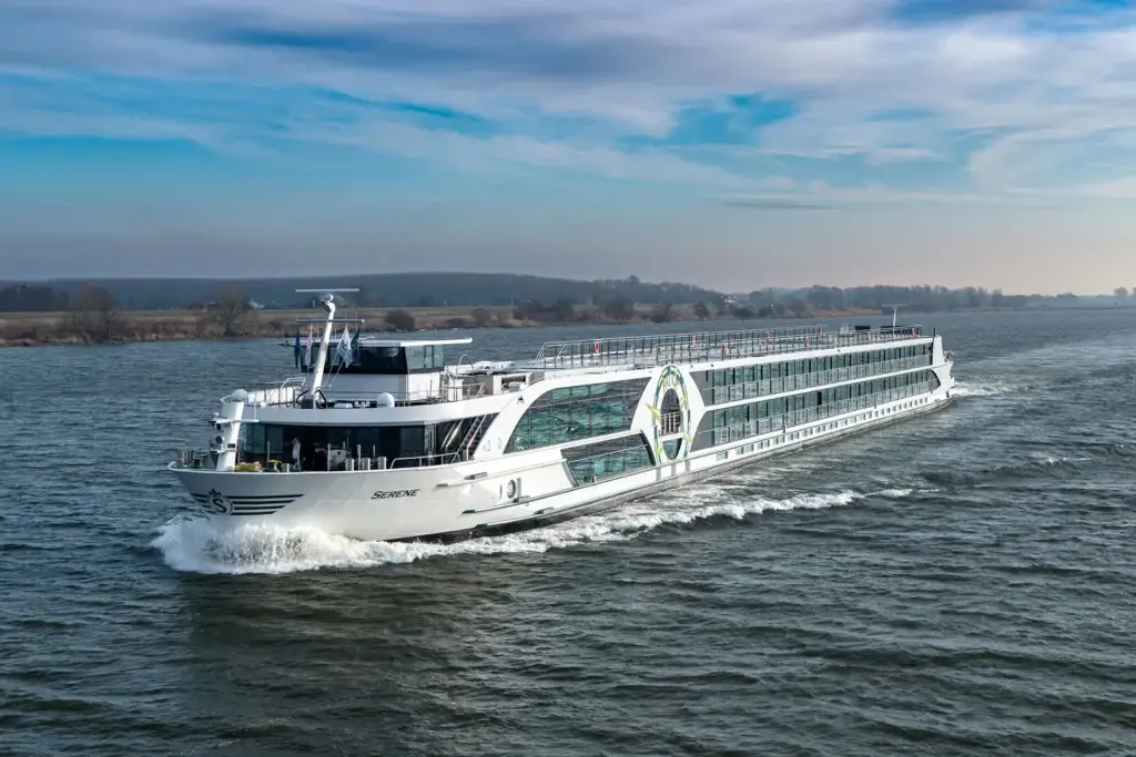 Photo of Tauck MS Serene riverboat cruising open waters under blue sky