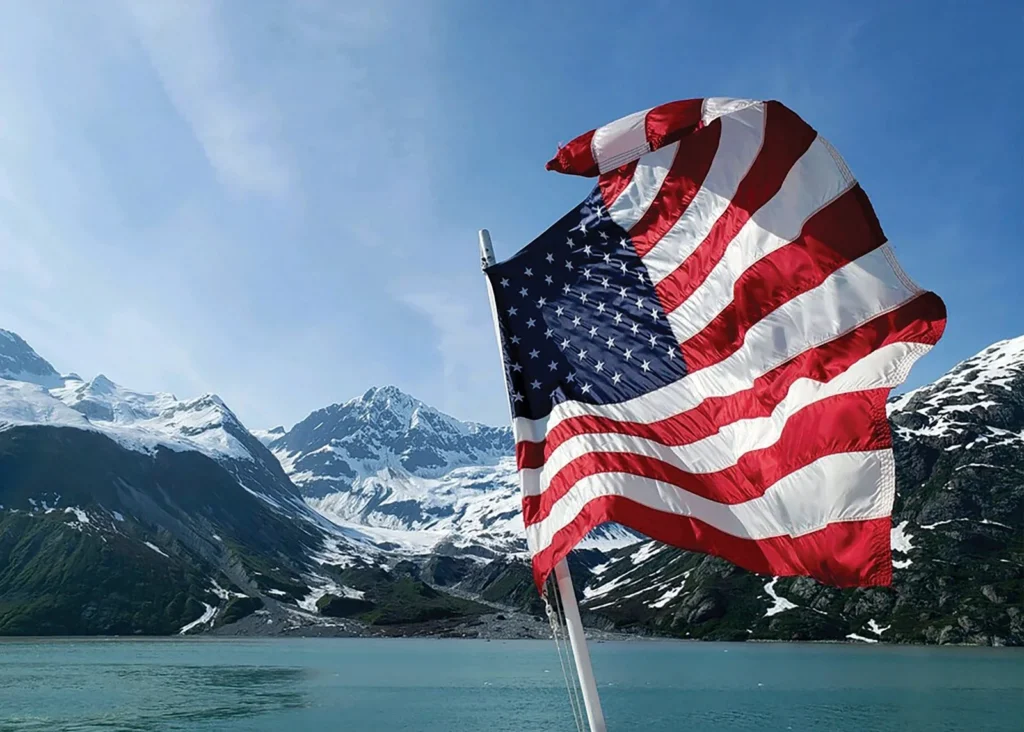 Photo of US flag on cruise ship deck for alaska cruise inside passage vs glacier bay trip