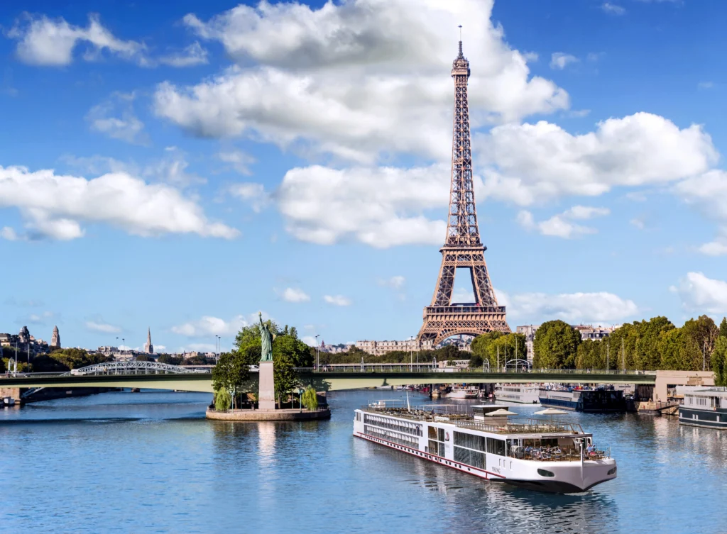 Photo of Viking River Cruises ship sailing on Seine River near Eiffel Tower in Paris