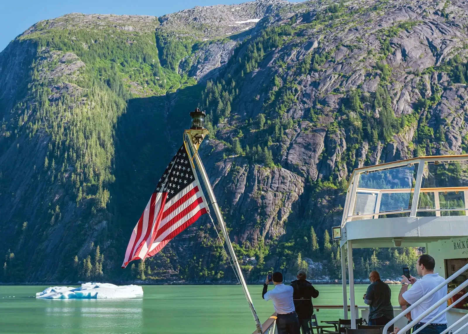 Photo of an American Cruise Lines Alaskan cruise ship passing Endicott Arm mountains