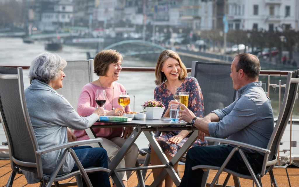 Photo of passengers enjoying drinks on top deck of Viking Longship