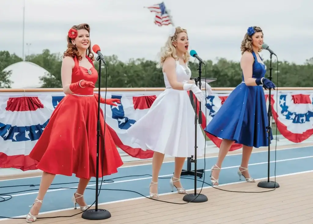 Photo of performers singing in pros and cons of American cruise lines