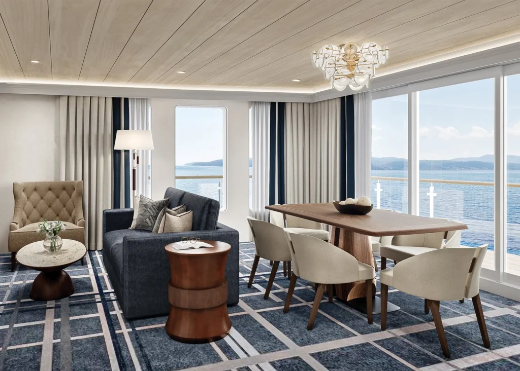 Photo of the spacious signature suite living area inside American Anthem ship